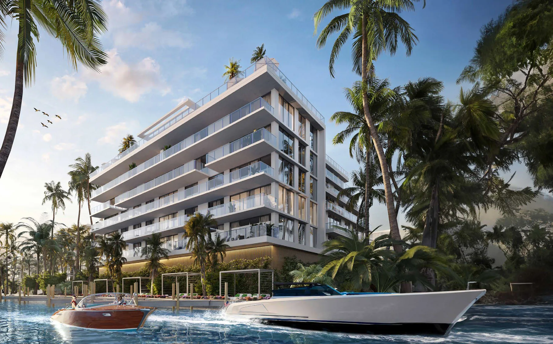 Render de Origin visto desde el agua a la hora dorada: el edificio blanco de terrazas escalonadas enmarcado por palmeras, con una lancha clásica de madera y una embarcación a motor moderna pasando frente a los muelles privados.