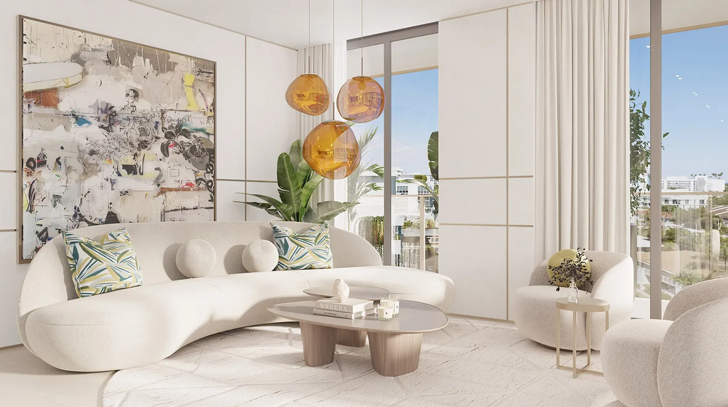 Un salón de Origin con un sofá curvo color crema, tres lámparas colgantes de vidrio ámbar y un gran lienzo abstracto, que se abre mediante ventanales de piso a techo a un balcón con plantas.