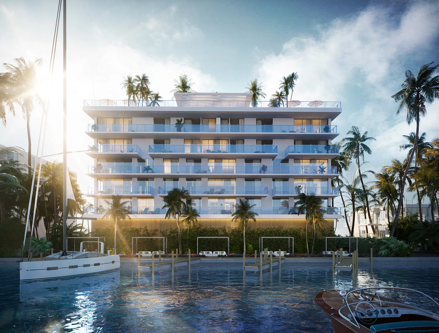 Imagen ilustrativa del edificio Origin visto desde el agua al atardecer, con balcones de cristal superpuestos tras las palmeras y un velero amarrado a la izquierda.